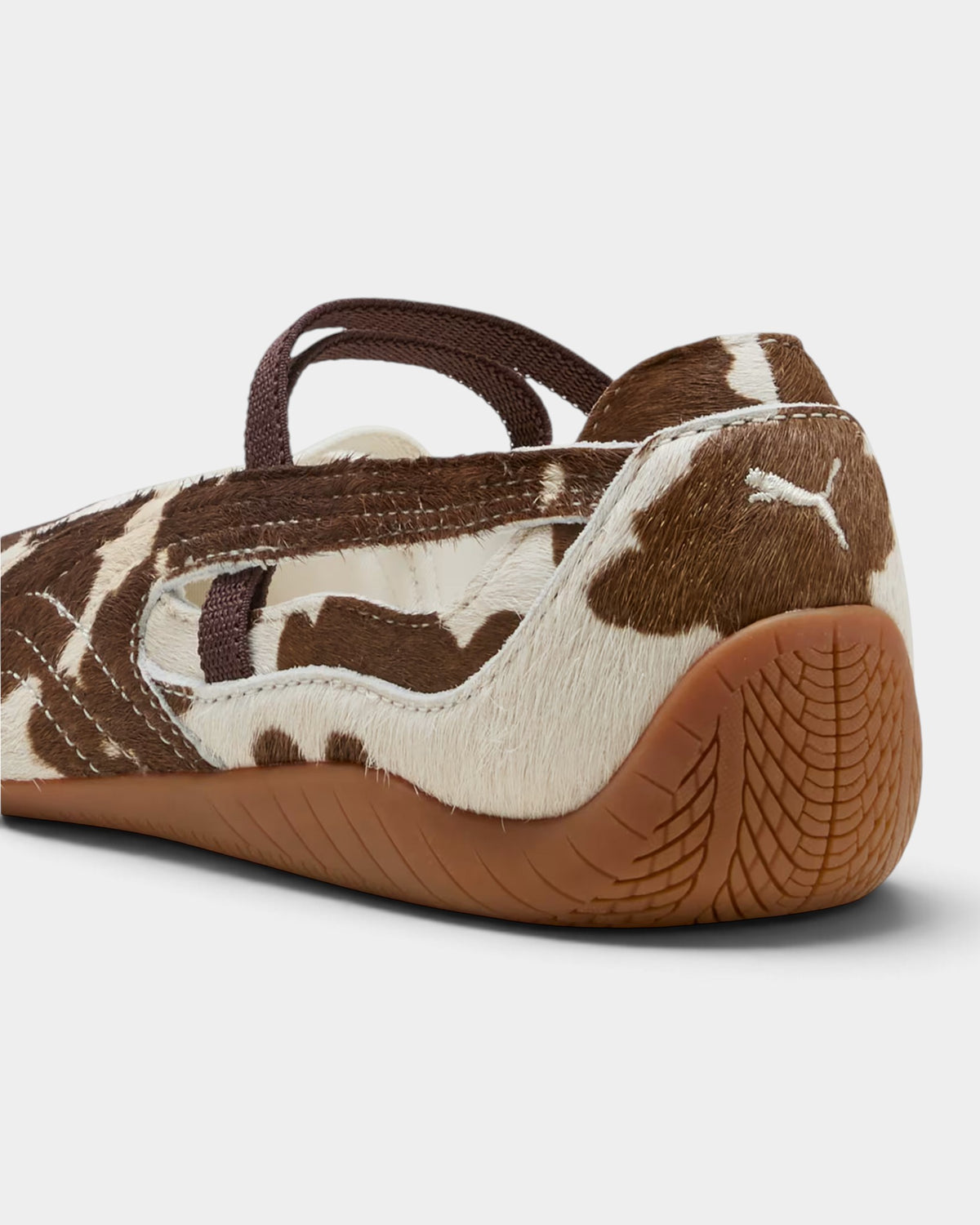 Lockwood Avenue Puma Speedcat ballet shoes in brown and white cow-print pony hair with a tire-tread rubber outsole.