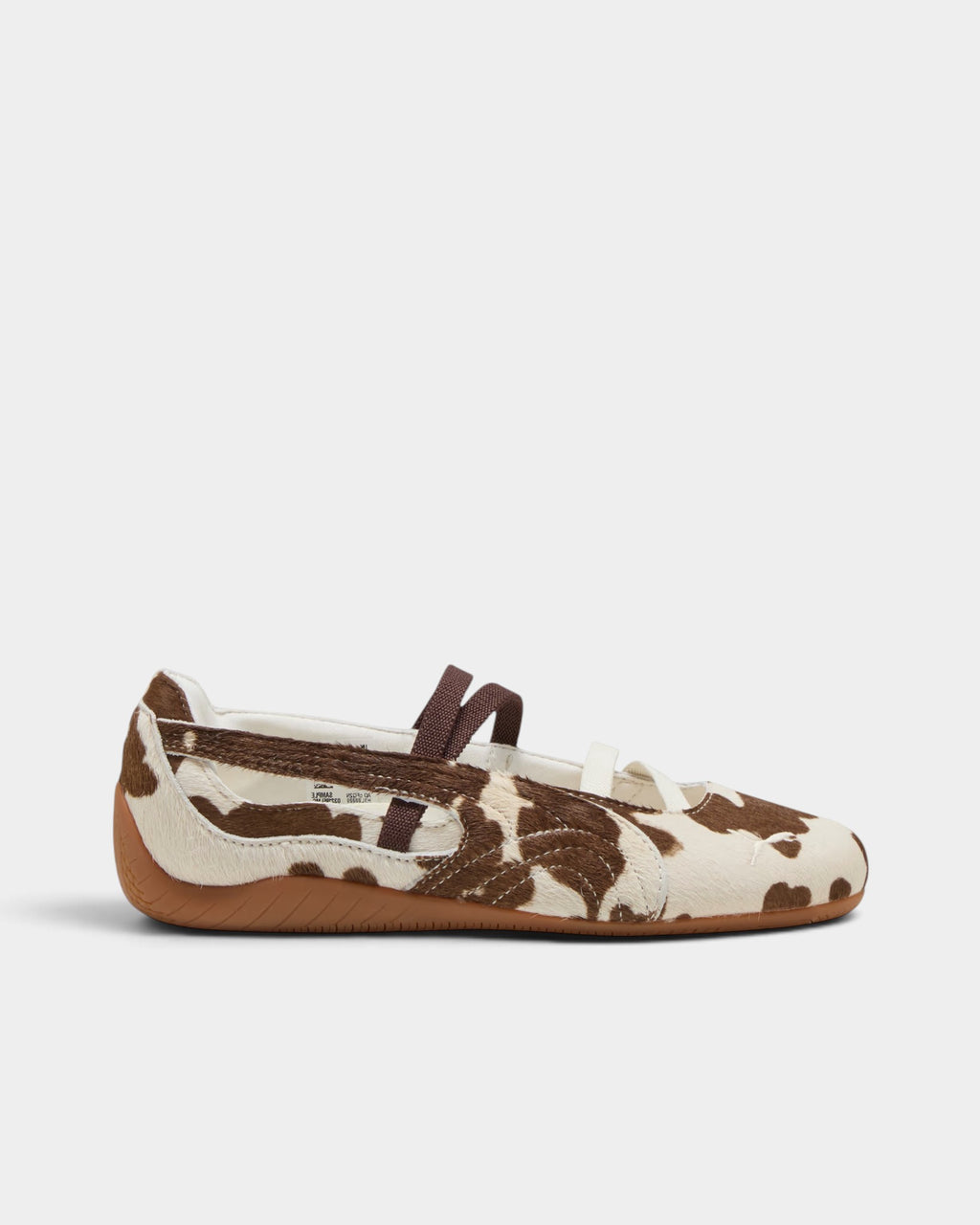 Lockwood Avenue Puma Speedcat ballet shoes in brown and white cow-print pony hair with elastic straps and rubber sole.