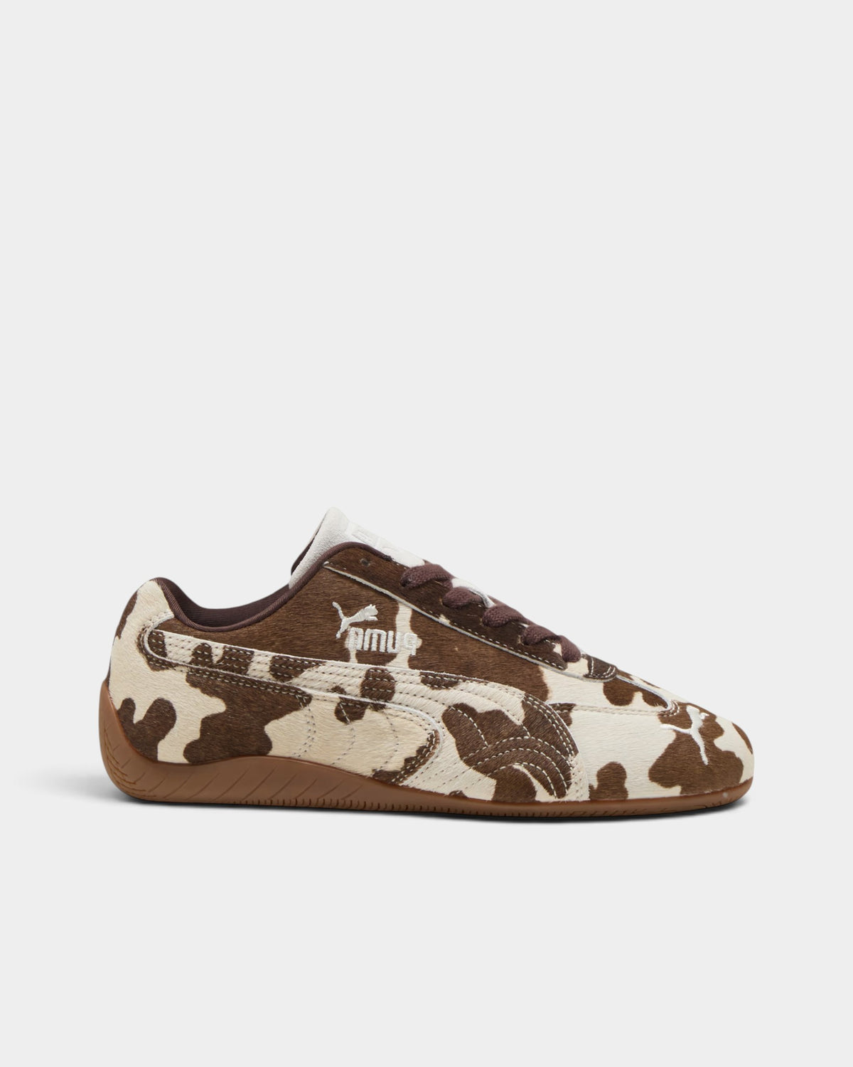 Lockwood Avenue Puma Speedcat women's sneakers featuring a cream and brown cow-print faux hair upper and gum outsole.