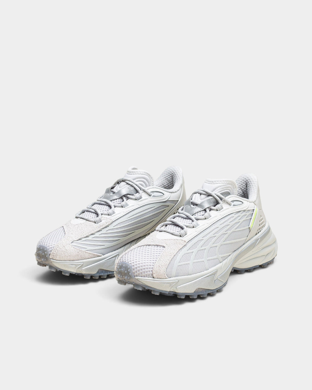 Lockwood Avenue Puma Spirex x PLEASURES sneakers in glacial gray with mesh, hairy suede, and spike-runner outsole.