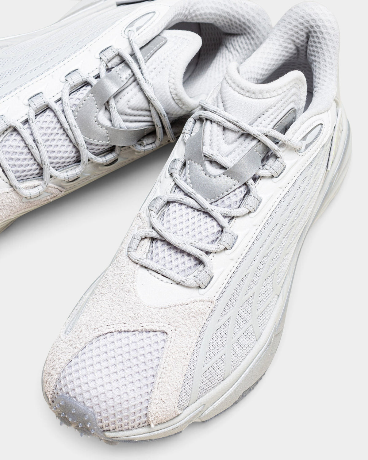 Lockwood Avenue Puma Spirex x PLEASURES glacial gray sneakers featuring mesh, hairy suede, and TPU overlays.