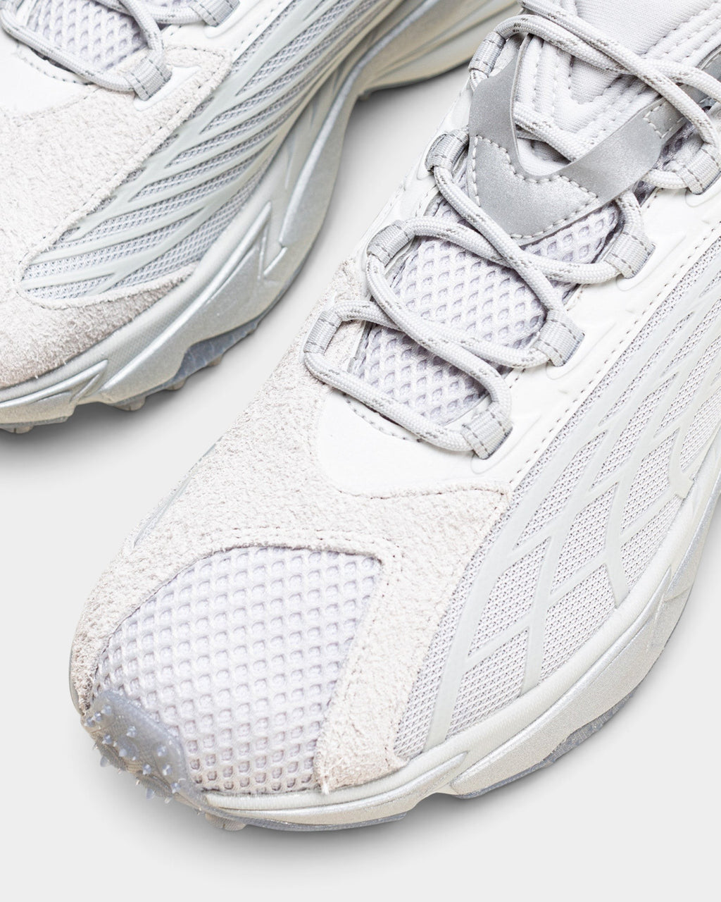 Lockwood Avenue Puma Spirex x PLEASURES sneakers in glacial gray with mesh, suede, and TPU overlays.
