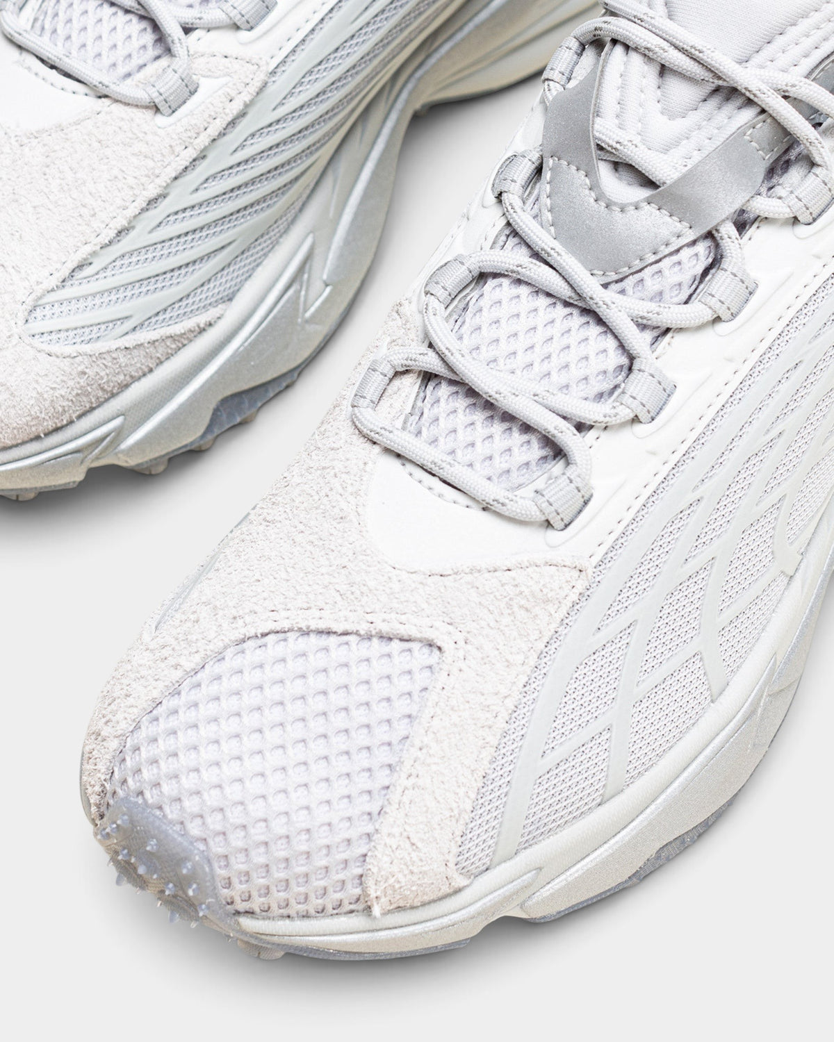 Lockwood Avenue Puma Spirex x PLEASURES sneakers in glacial gray with mesh, suede, and TPU overlays.