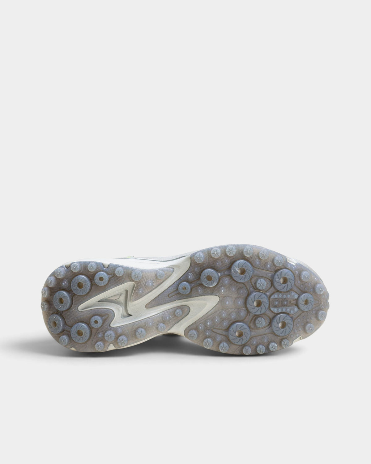 Lockwood Avenue Puma Spirex x PLEASURES sneaker showing the semi-transparent rubber outsole with spike-runner design.