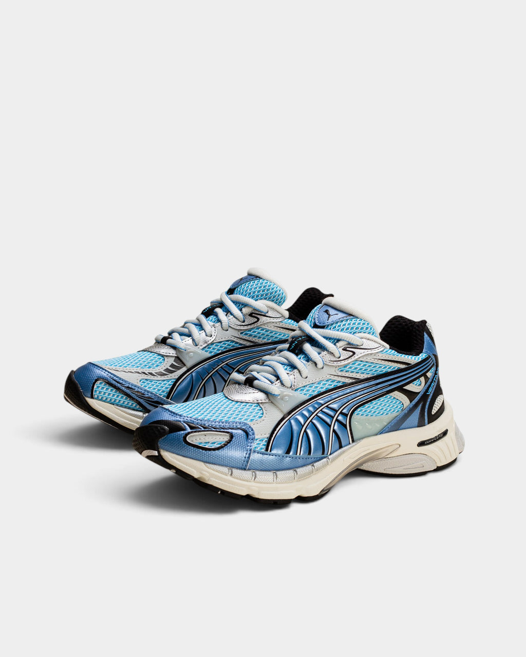 Lockwood Avenue Puma Veritana Sentient runner in bright aqua and white mesh with synthetic leather overlays.