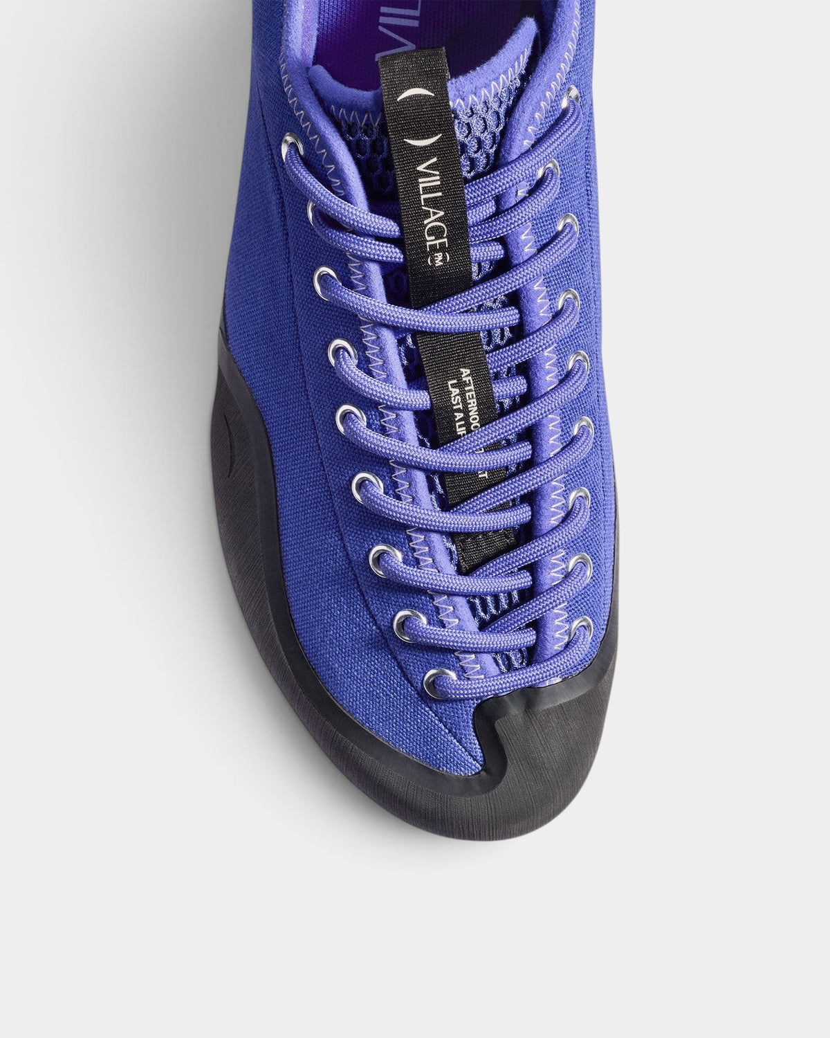 Lockwood Avenue Village PM 1PM purple canvas skate shoe with asymmetrical lacing and black rubber toe cap.