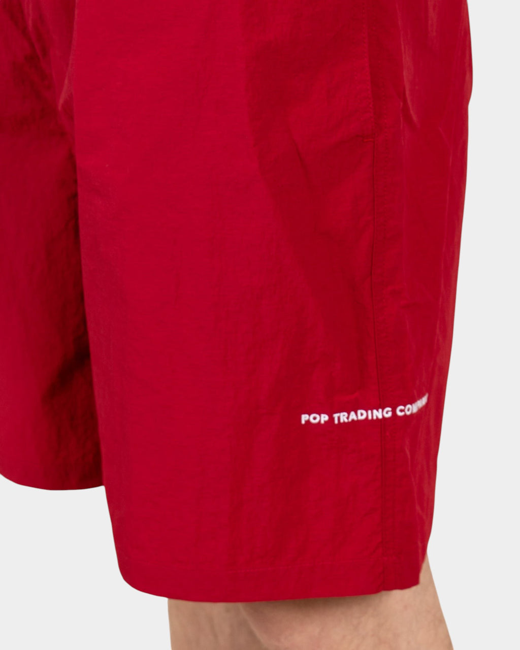 Lockwood Avenue Pop Trading Company red nylon painter shorts with white embroidered logo detail