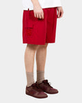 Lockwood Avenue red nylon painter shorts with side mesh pocket and drawstring waist worn by a model