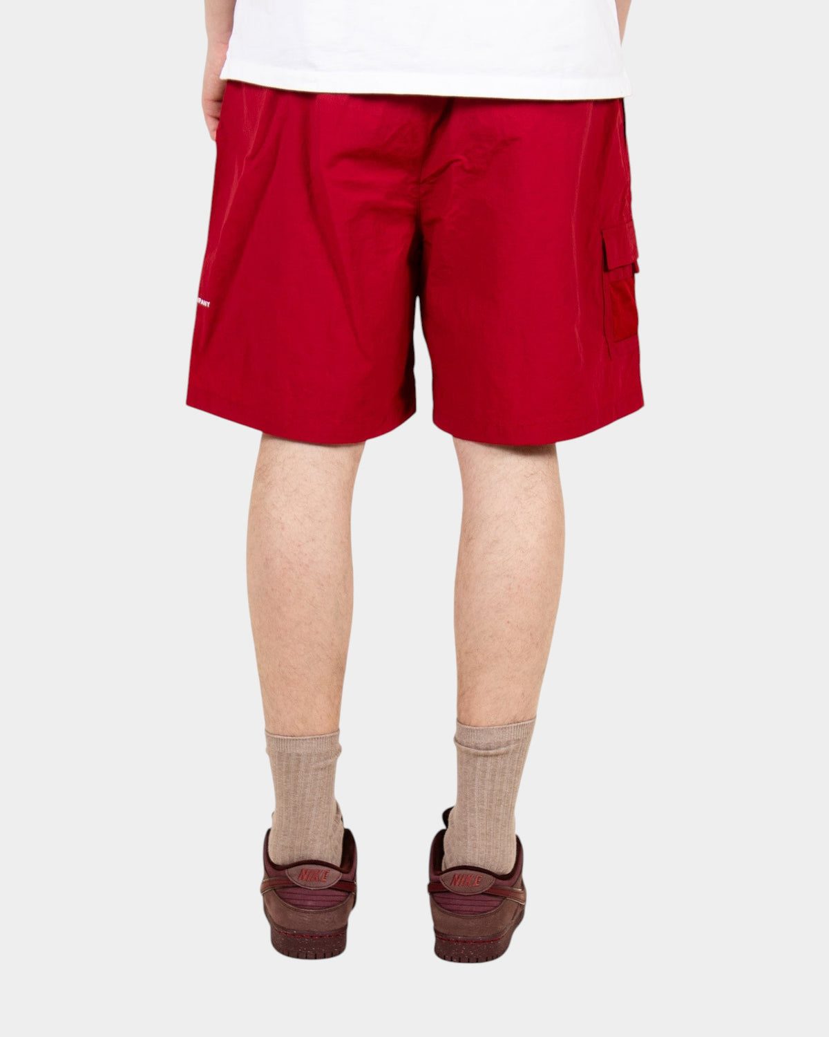Lockwood Avenue Pop Trading Company red nylon painter shorts with side pocket and drawstring waist, back view
