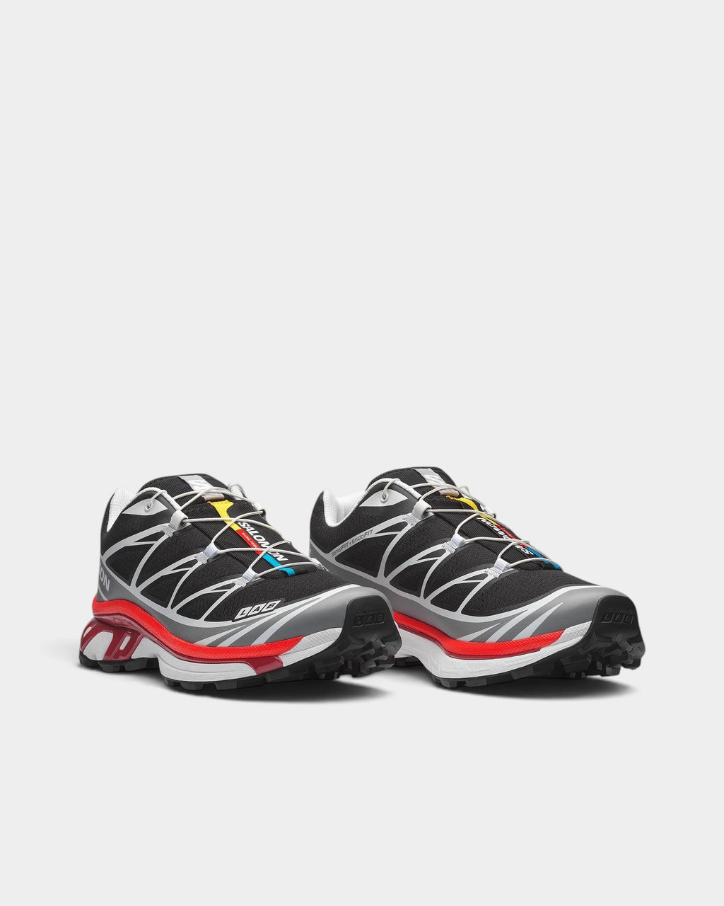 Lockwood Avenue Salomon XT-6 trail running shoes in black with red and yellow accents, featuring a mesh upper.