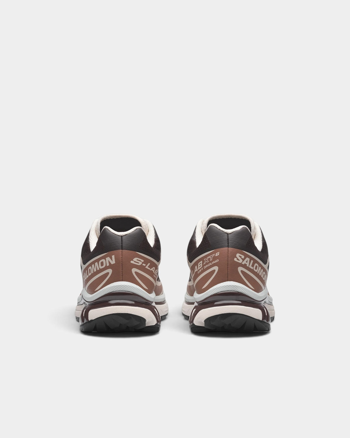 Lockwood Avenue Salomon XT-6 trail running shoes in brown and beige, featuring a rear view of the durable lugged sole.