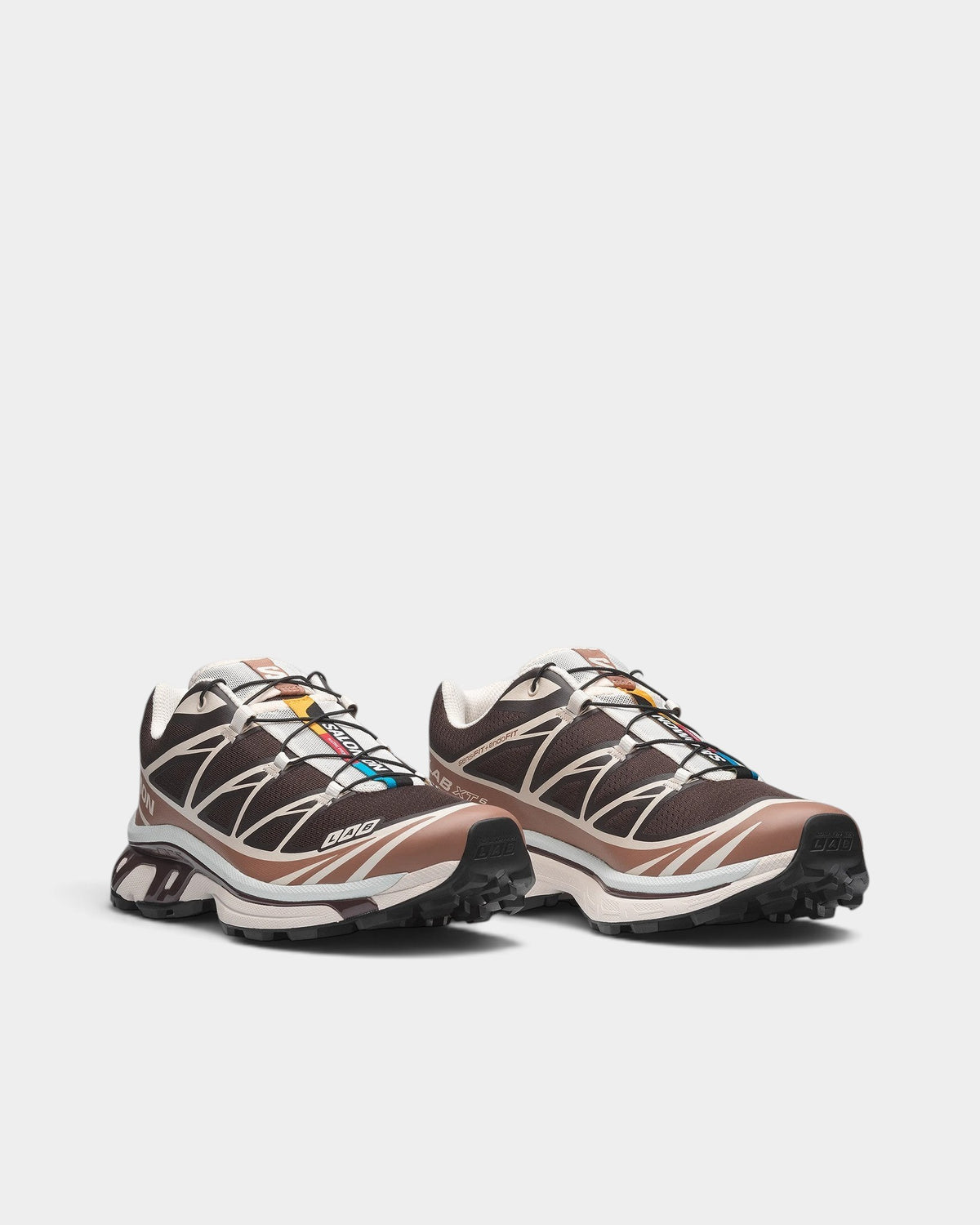 Lockwood Avenue Salomon XT-6 trail running shoes in brown and beige with Quicklace system and durable mesh upper.