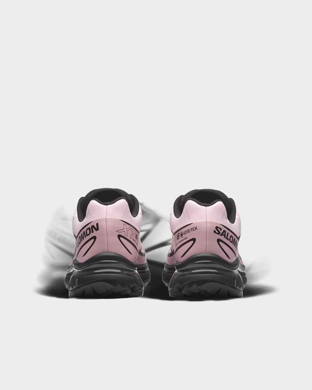 Lockwood Avenue Salomon XT-6 Gore-Tex waterproof trail running shoes in light pink with black lugged outsoles, rear view