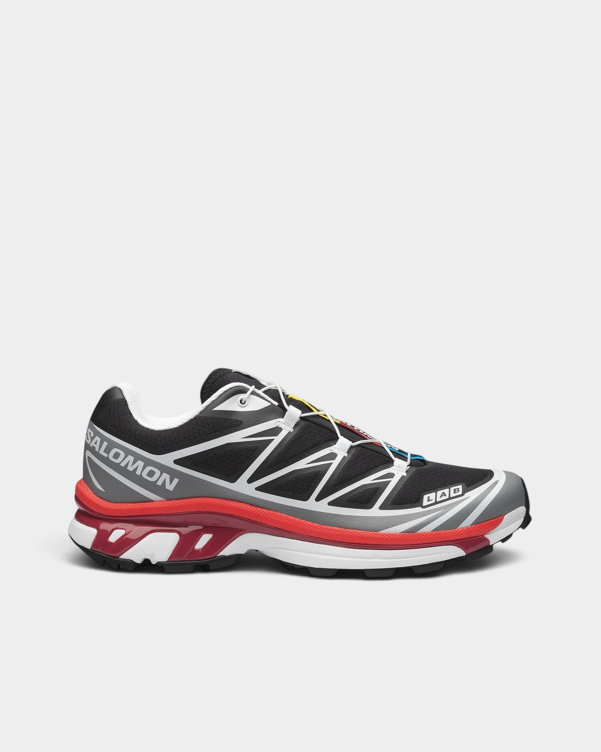 Lockwood Avenue Salomon XT-6 trail running shoes in black, grey, and red with mesh upper and Quicklace system.