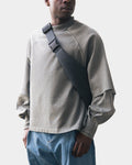 Lockwood Avenue Seventh raglan layered top in olive cotton with raw-hemmed short sleeves and extended under sleeves.