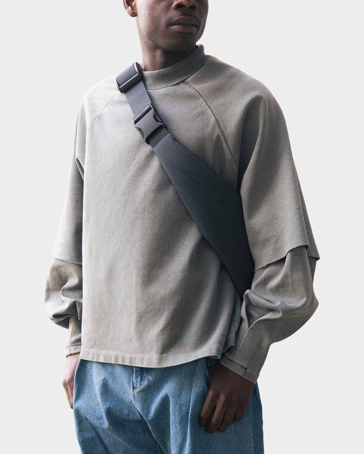 Lockwood Avenue Seventh raglan layered top in olive cotton with raw-hemmed short sleeves and extended under sleeves.