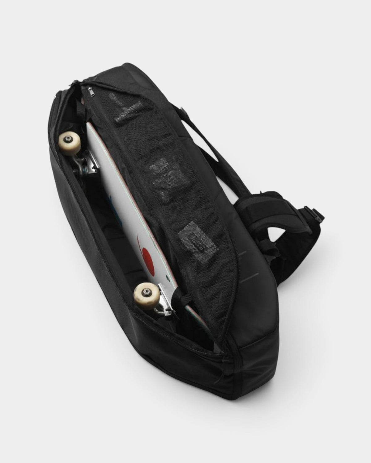 Lockwood Avenue DB Journey 65L black travel duffel bag with a skateboard stored in the side compartment