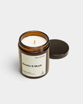 Lockwood Avenue Earl of East Smoke & Musk soy wax candle in an amber glass jar with a black lid