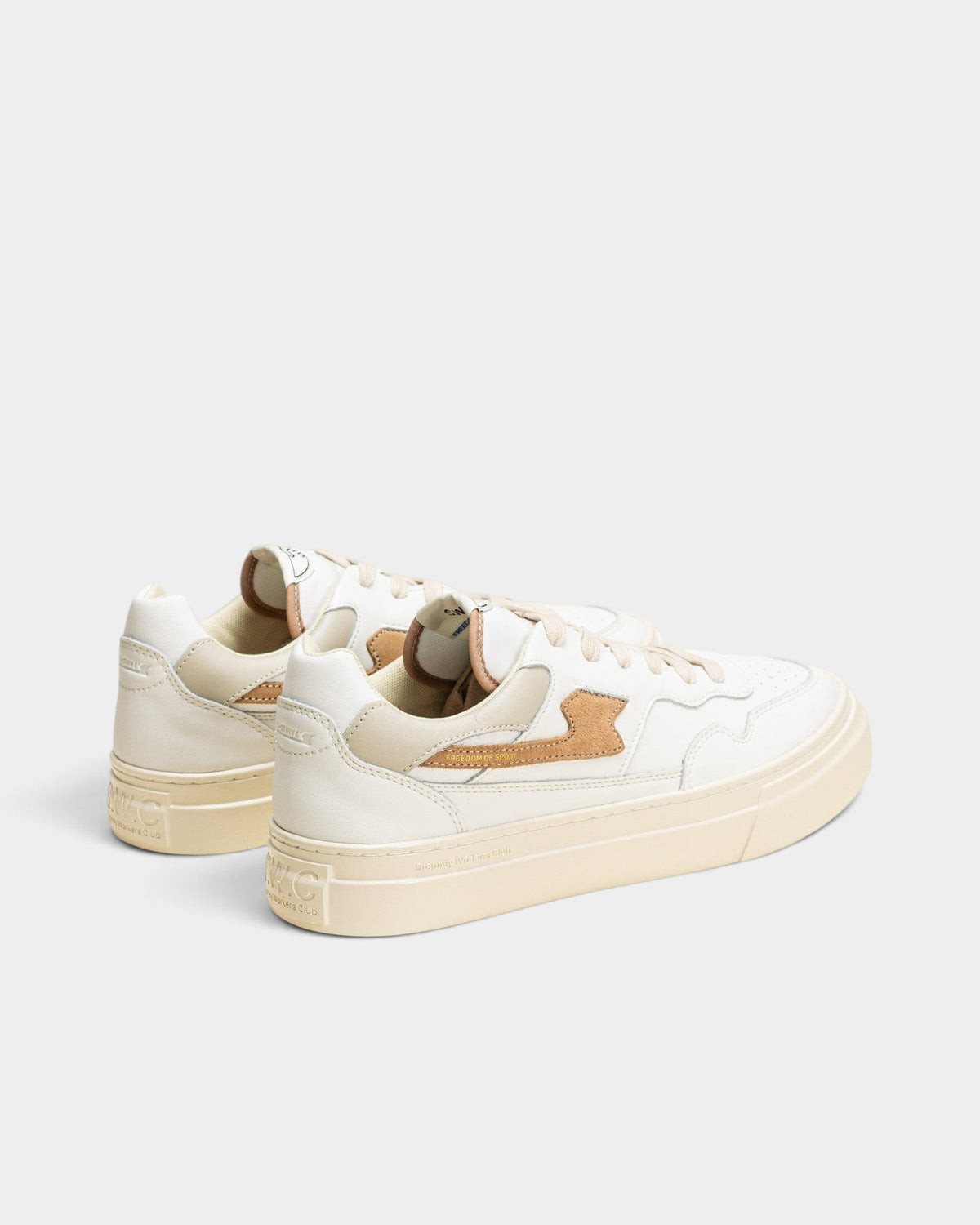 Lockwood Avenue Stepney Workers Club Pearl S-Strike white leather court sneakers with earth brown suede accents.