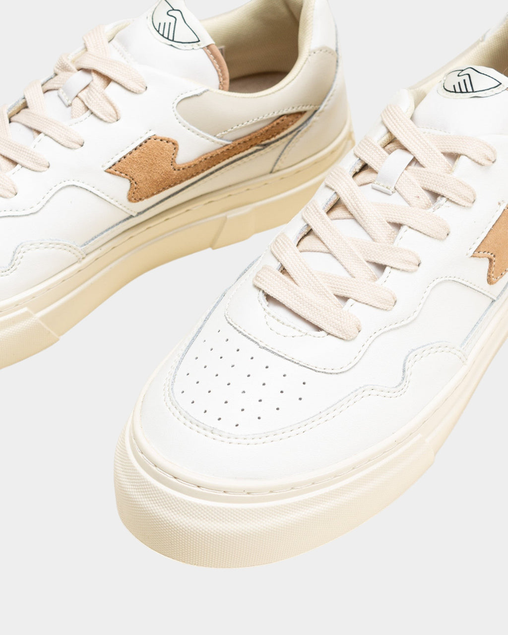 Lockwood Avenue Stepney Workers Club Pearl S-Strike white leather sneakers with earth brown accents and cupsole.