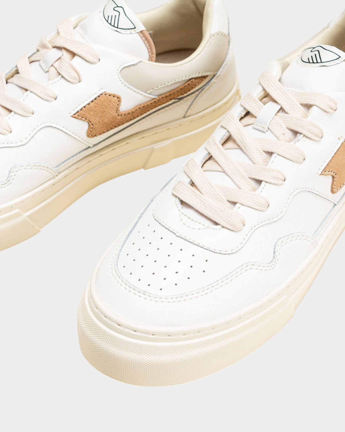 Lockwood Avenue Stepney Workers Club Pearl S-Strike white leather sneakers with earth brown accents and cupsole.