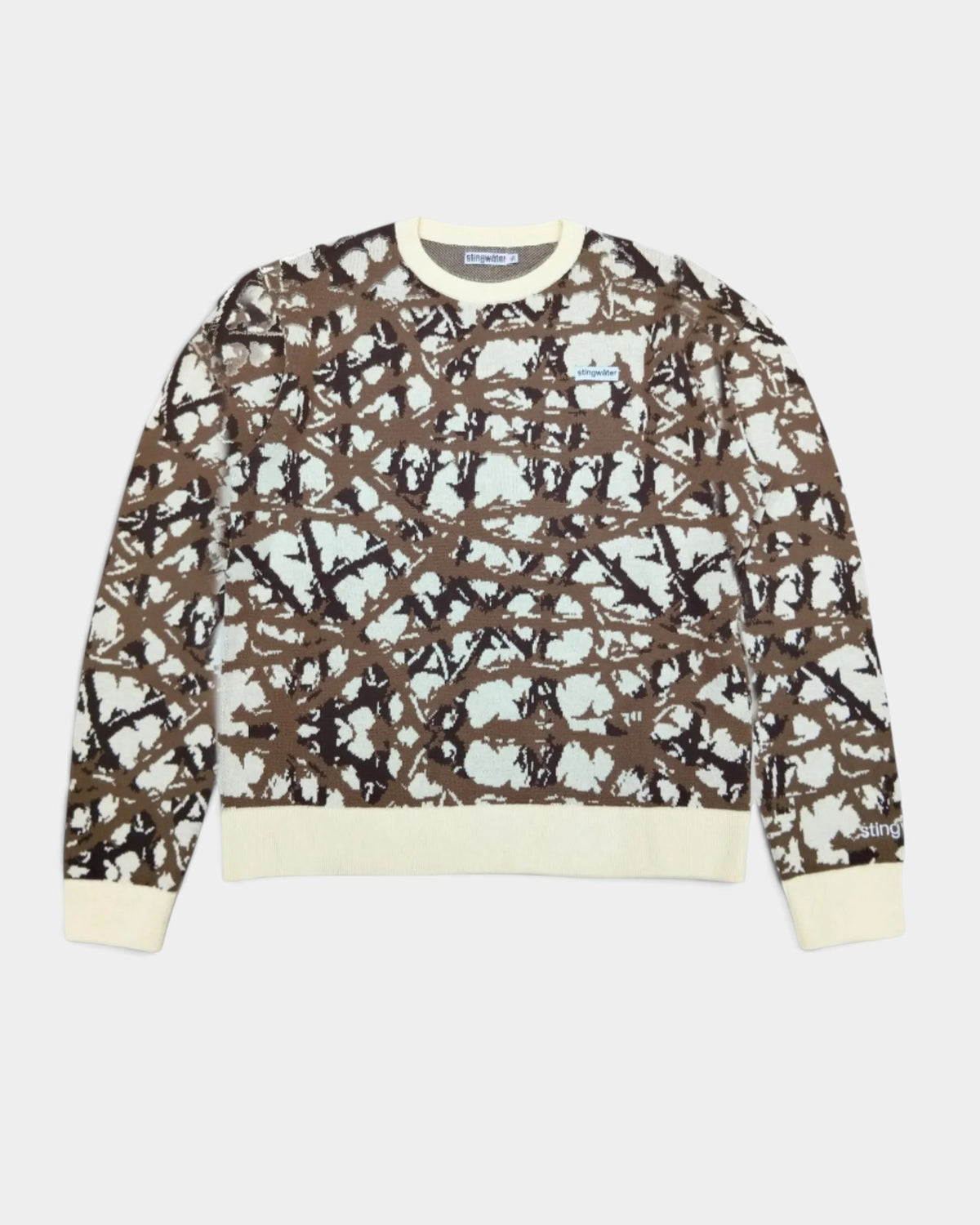 Lockwood Avenue Stingwater Thorn knit sweater in cream and brown cotton jacquard with ribbed cuffs and chest label.