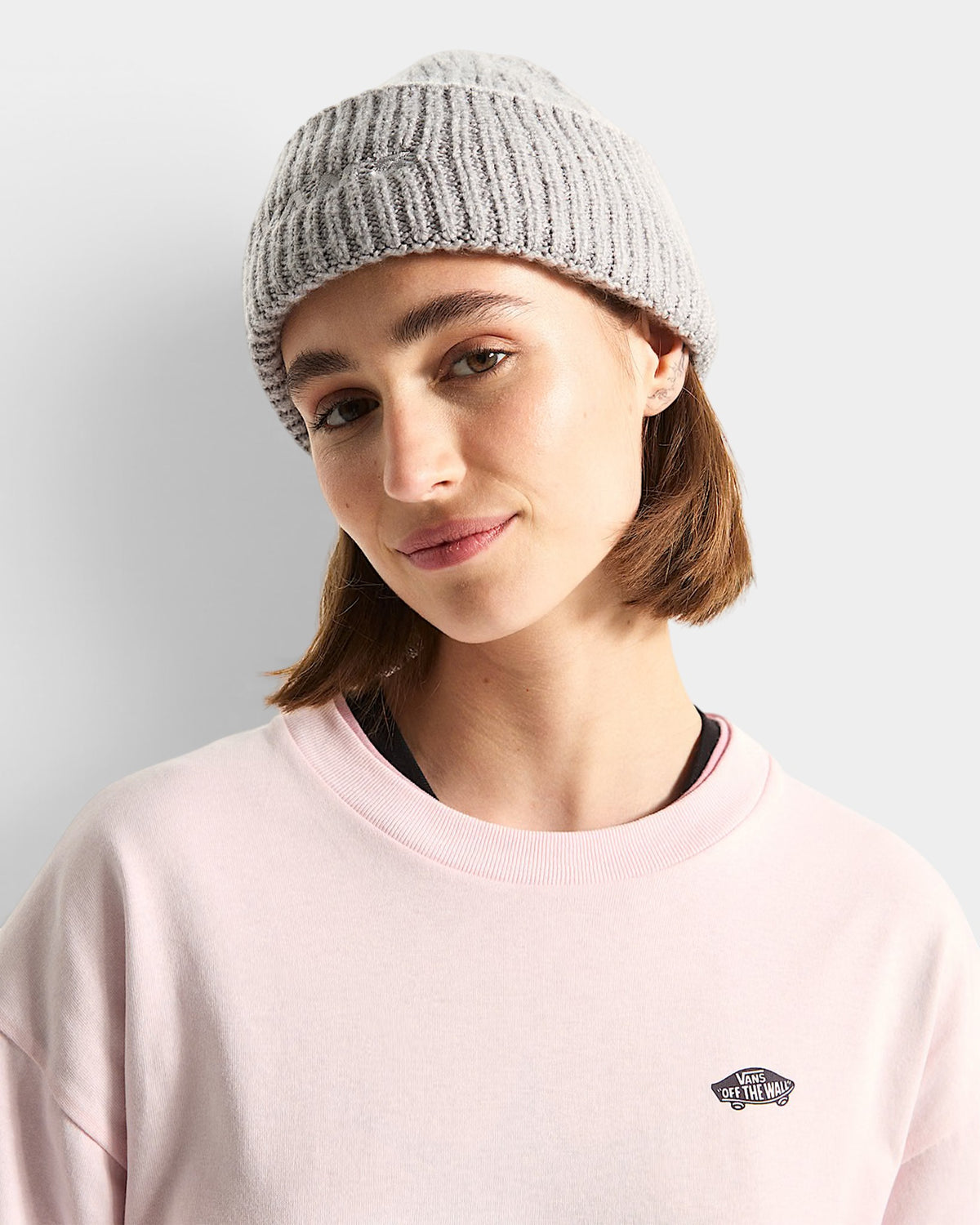 Lockwood Avenue Vans Densmore heather gray chunky knit beanie with wide cuff worn by a woman in a pink shirt