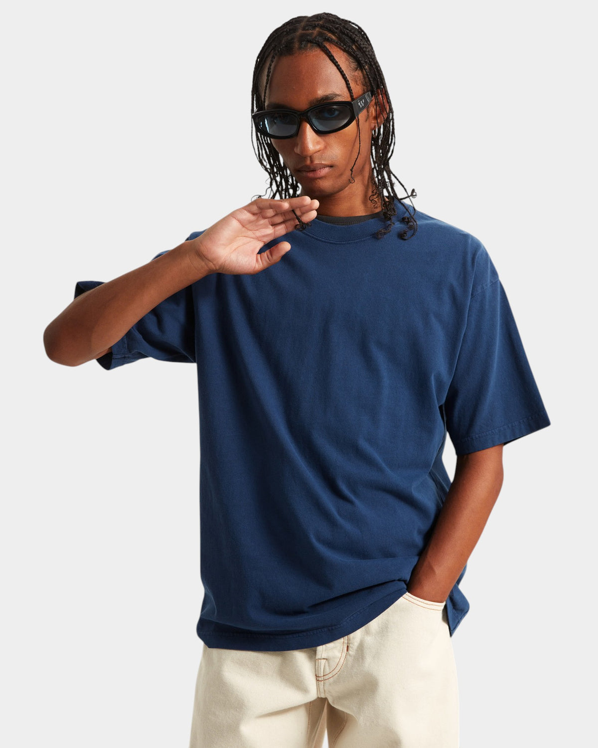 Lockwood Avenue model wearing a navy blue Vans Premium loose fit cotton t-shirt with a crew neck and sunglasses.