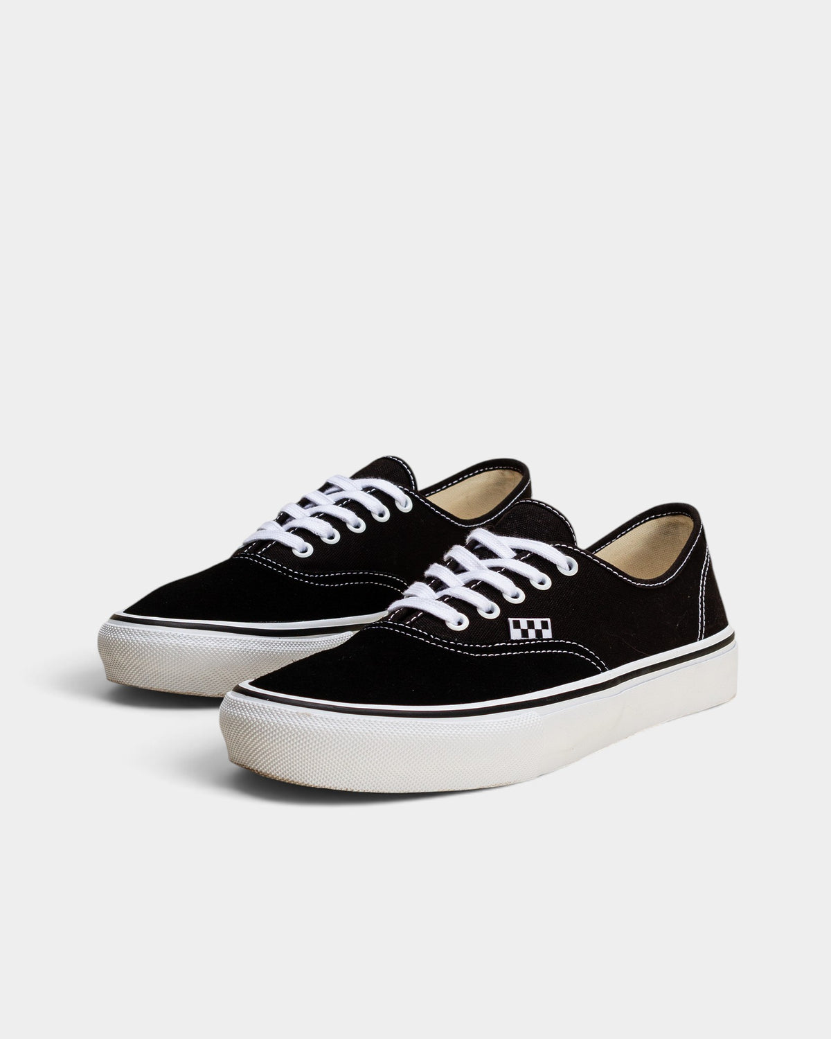 Lockwood Avenue Vans Skate Authentic black canvas low-top sneakers with white laces and gum rubber outsole.