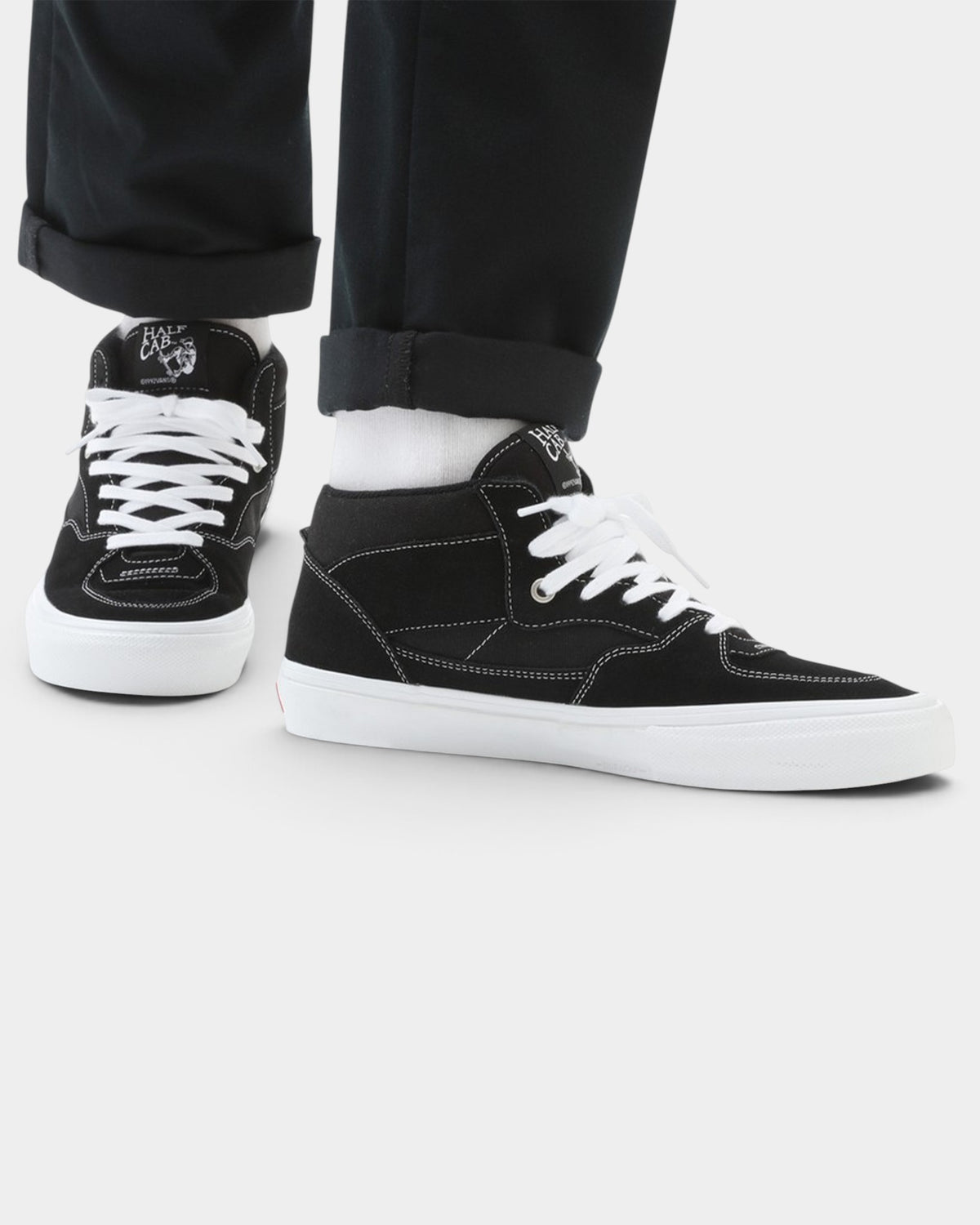 Lockwood Avenue Vans Skate Half Cab shoes in black suede with white laces and vulcanized rubber soles on a skater