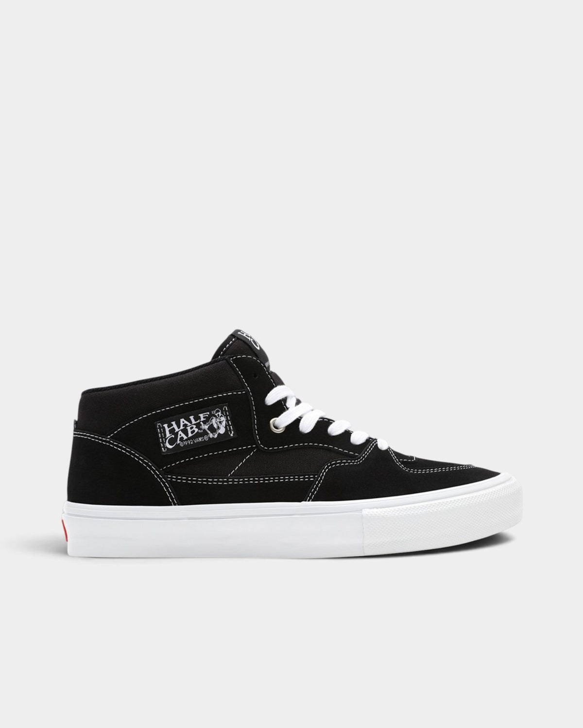 Lockwood Avenue Vans Skate Half Cab mid-top sneakers in black suede with white laces and a white vulcanized sole.