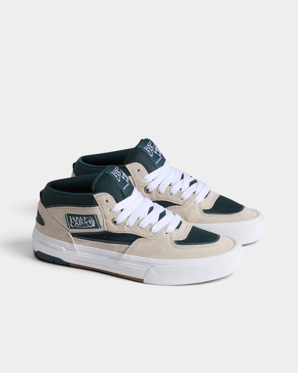 Lockwood Avenue Vans Skate Half Cab mid-top sneakers in oatmeal suede and deep teal mesh with white laces.