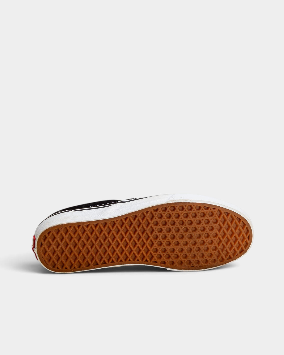 Lockwood Avenue Vans Classic Slip-On shoes showing the signature brown rubber waffle outsole from the bottom view