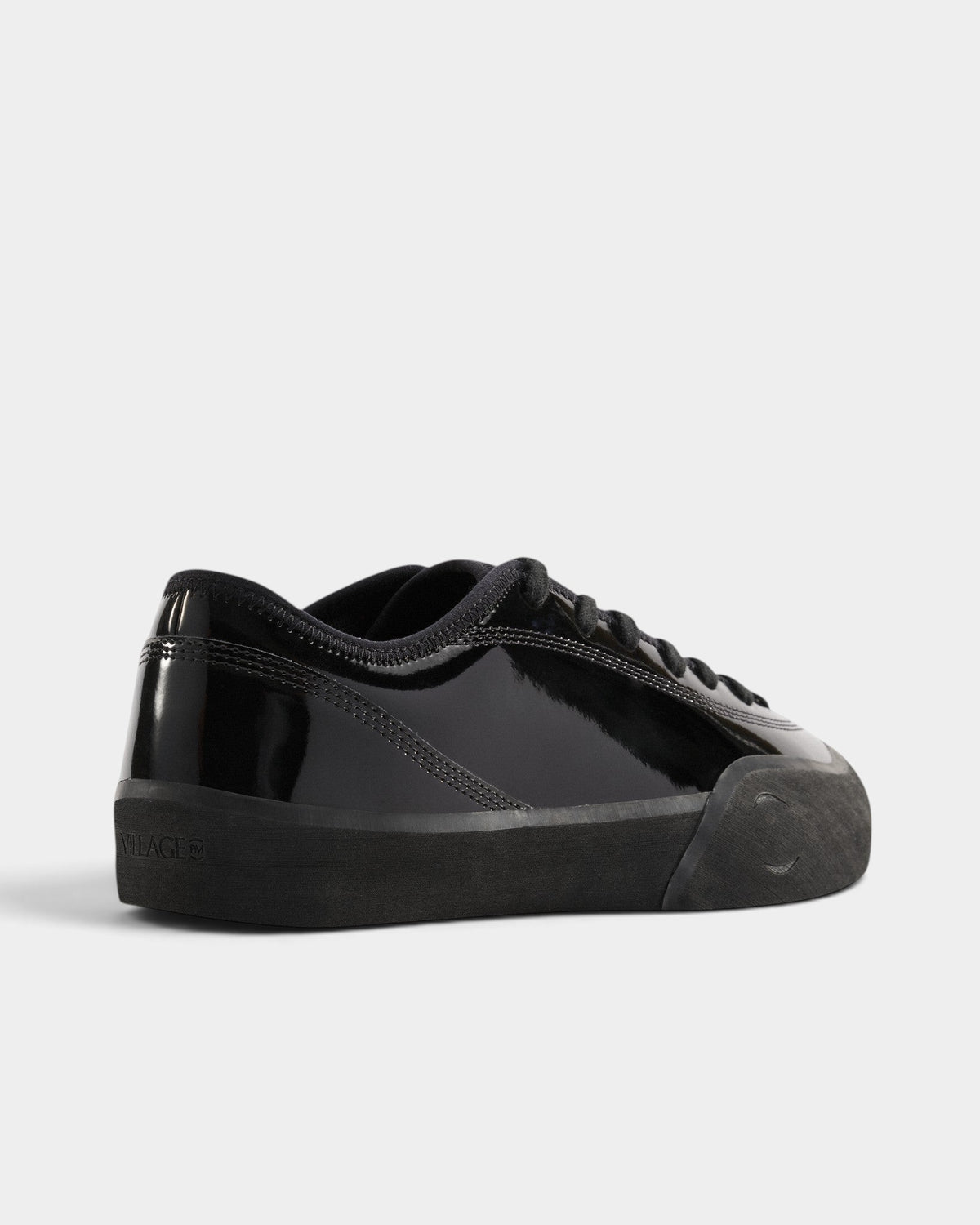 Lockwood Avenue Village PM 1.30PM skate shoes in gloss black synthetic leather with a rubber sole, rear view.