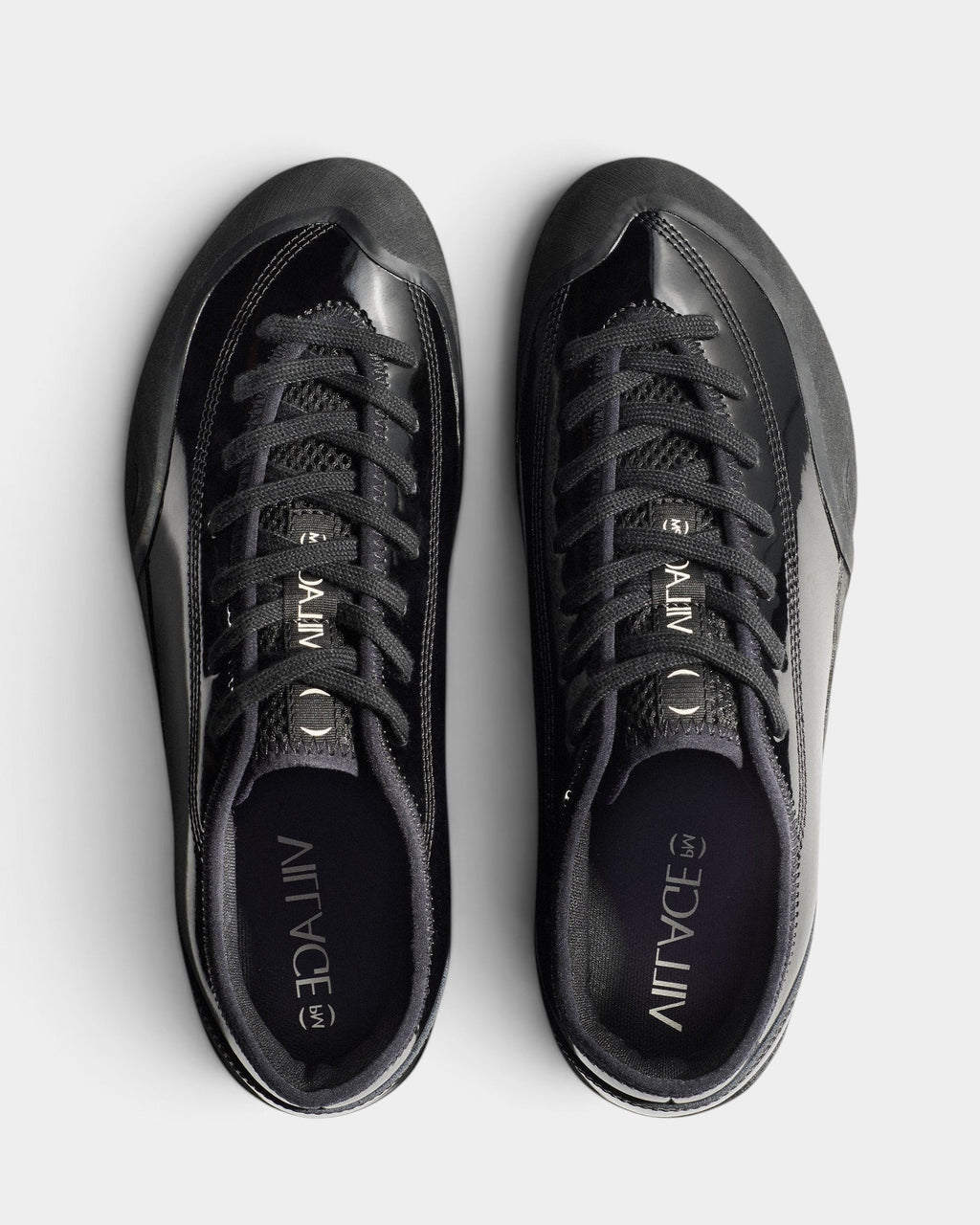 Lockwood Avenue Village PM 1.30PM skate shoes in gloss black synthetic leather with offset lacing and rubber soles.