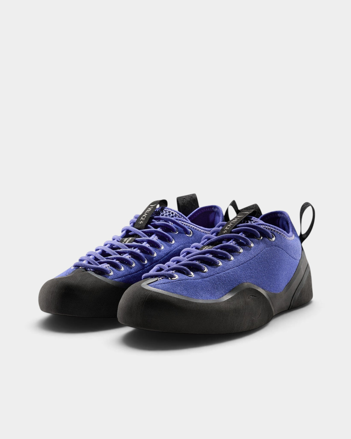 Lockwood Avenue Village PM 1PM purple canvas skate shoes with black rubber toe and heel wrap and offset lacing.