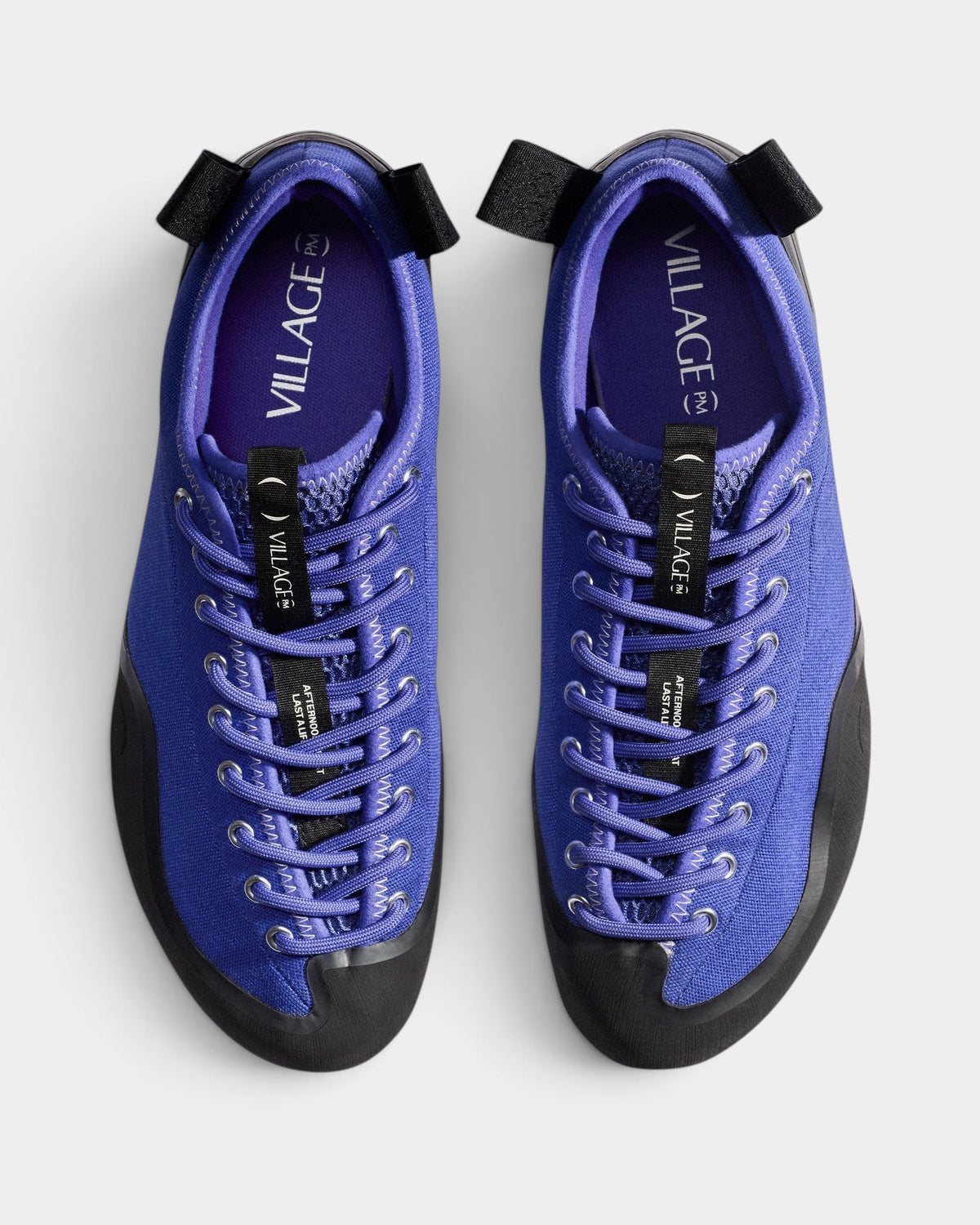 Lockwood Avenue Village PM 1PM purple canvas skate shoes with black rubber detailing and offset lacing, top view.