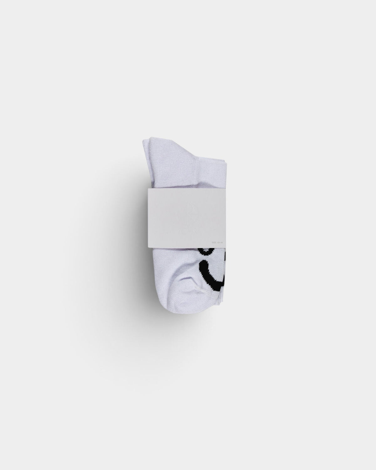 Lockwood Avenue white ribbed crew socks with woven happy face detail at the toe and branded paper packaging