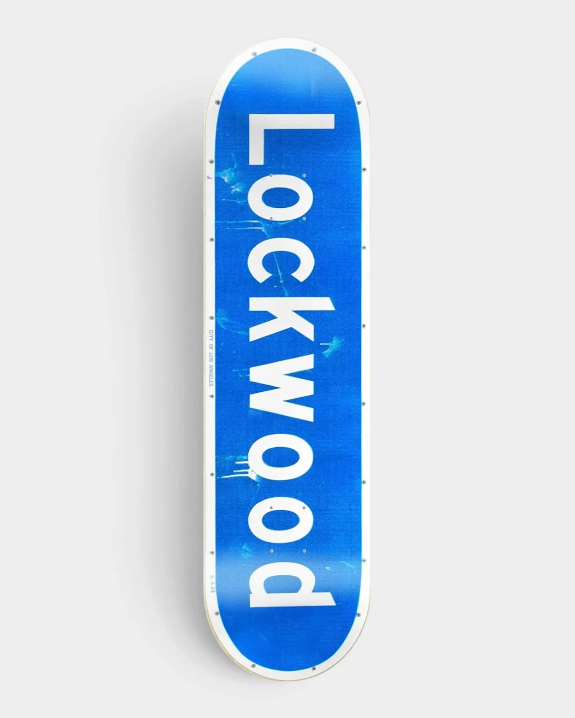 Lockwood Street Sign 7.5 inch skateboard deck made to look like a blue street sign, with Lockwood in large white letters, a white border and bolt heads along the edge