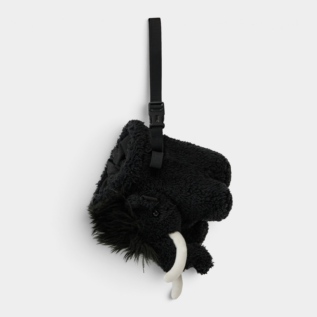Mammut Fluffy Chalk Bag in black hanging from its adjustable webbing strap, seen head on from above