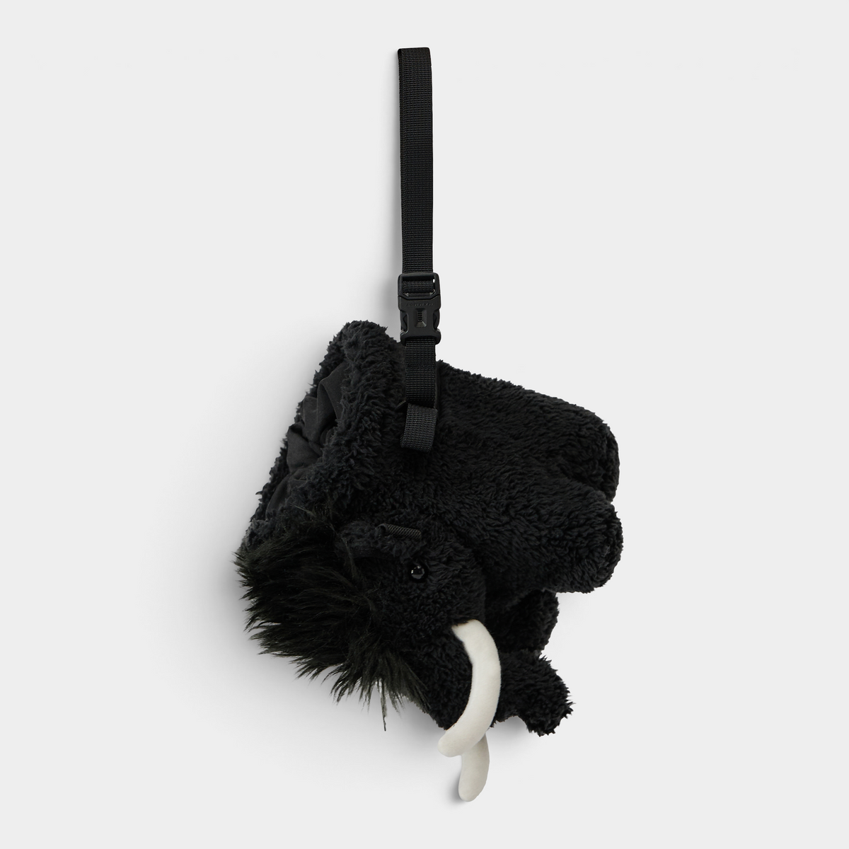 Mammut Fluffy Chalk Bag in black hanging from its adjustable webbing strap, seen head on from above