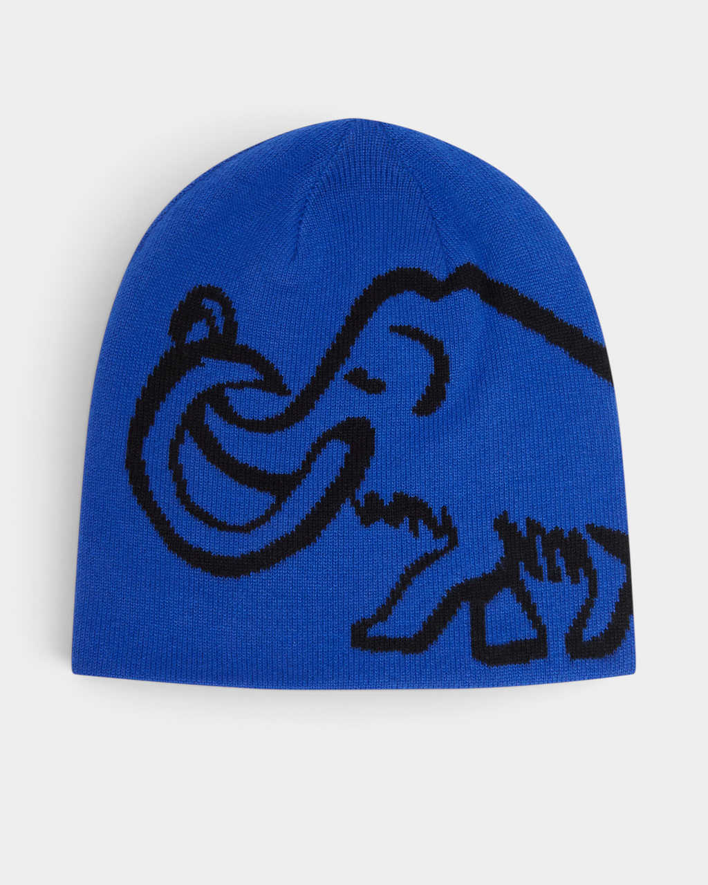 Mammut Logo Reversible Beanie in Eiger Blue-Black, a royal blue cuffless beanie with a large black knitted mammoth across the side