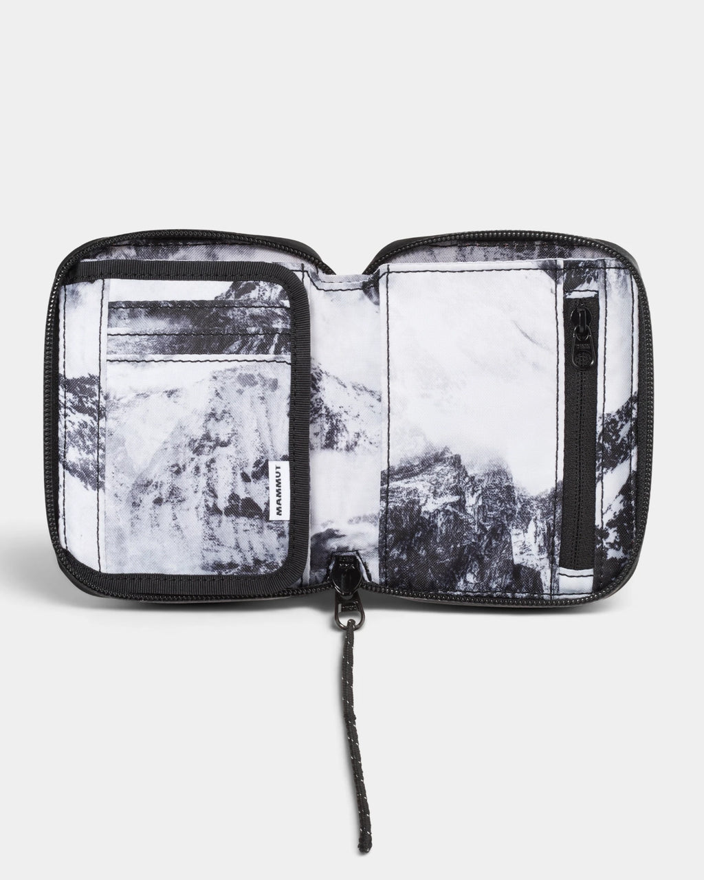 Mammut Seon Alpine Wallet opened flat, showing the card slots and zip pocket inside a black and white mountain print lining