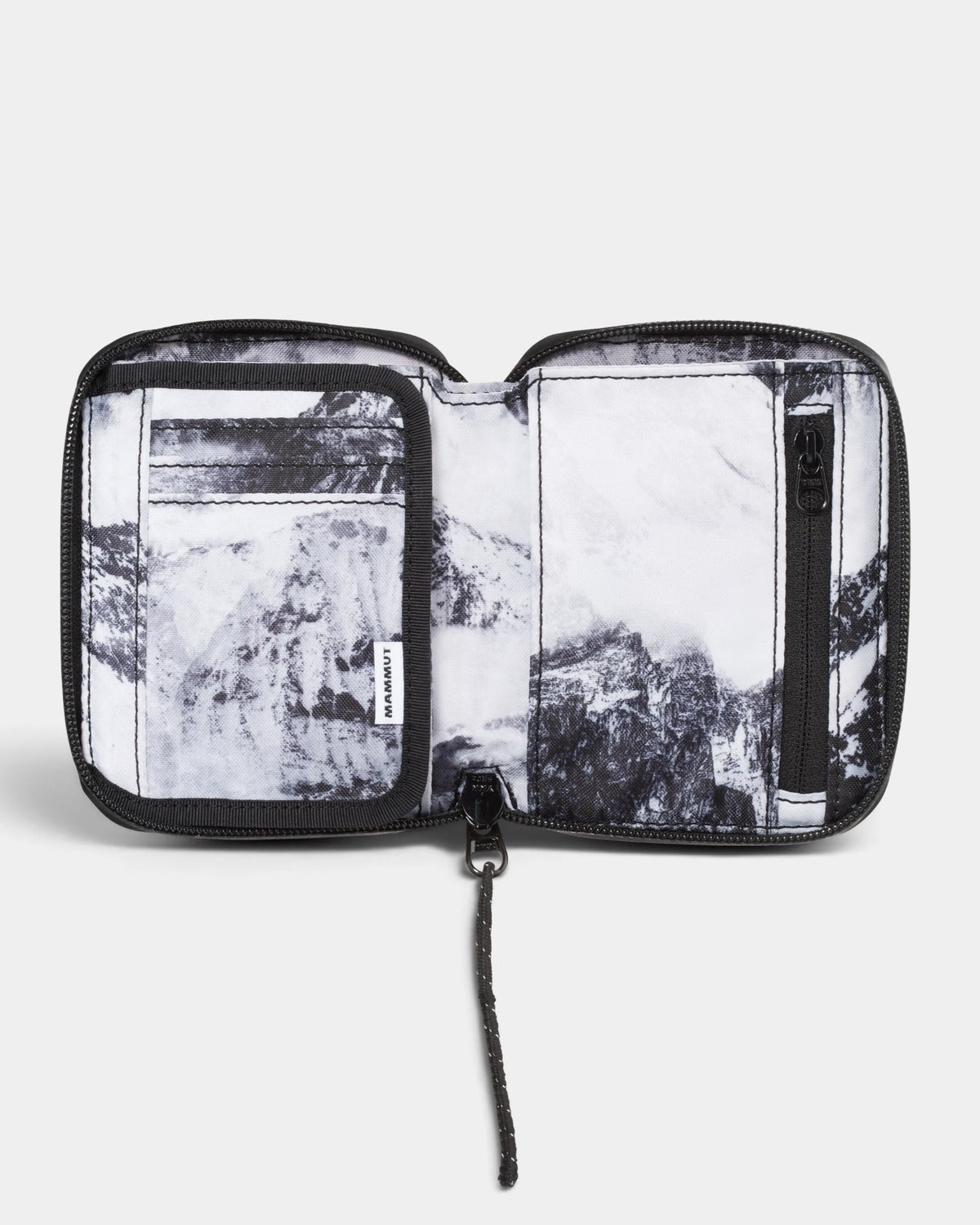 Mammut Seon Alpine Wallet opened flat, showing the card slots and zip pocket inside a black and white mountain print lining