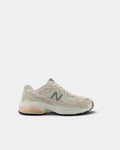 Lockwood Avenue New Balance 2010 kids shoe in turtledove suede and cream mesh, side view showing the grey N, shell pink panels and the peach ABZORB pods in the midsole
