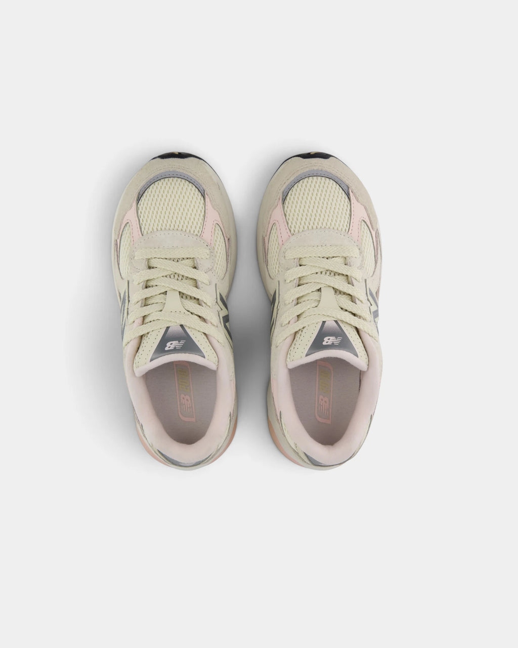 Lockwood Avenue New Balance 2010 kids shoes in turtledove seen from above, toes pointing up, with cream laces, mesh vamp and pink-lined collars