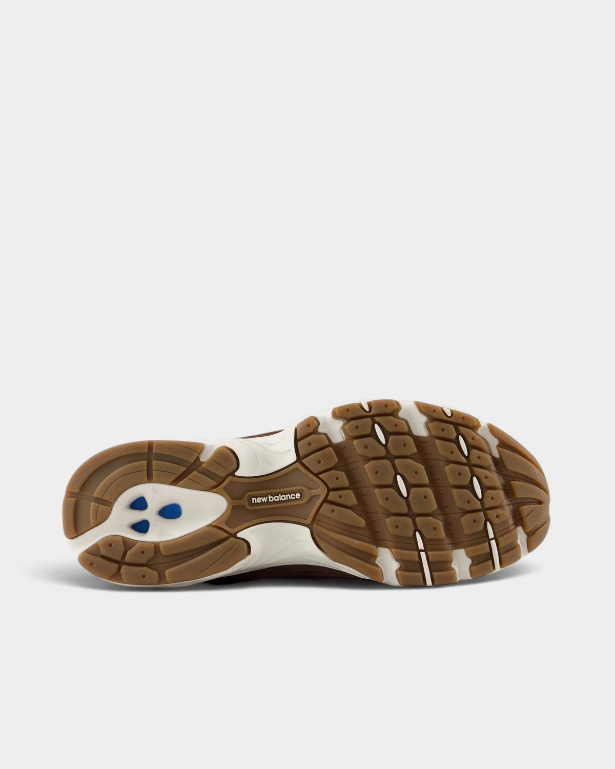 New Balance 530 Shoes in Pumpernickel/Sea Salt, outsole: gum rubber with raised tread blocks, a cream midsole edge and blue pods at the heel