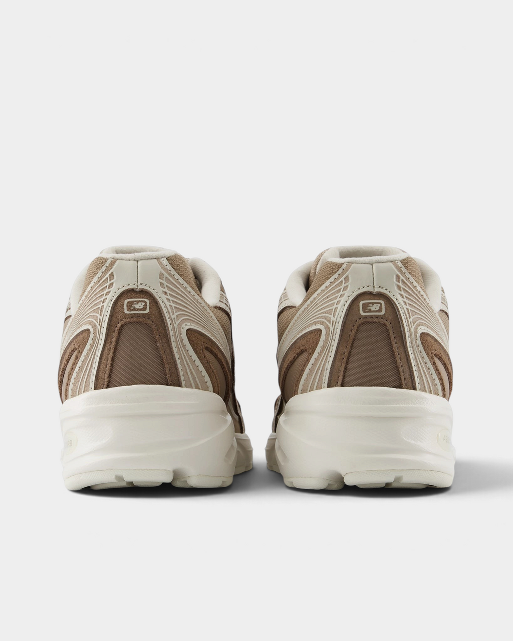 New Balance 740v2 Shoes in Mushroom/Driftwood, pair from behind: taupe heel panels with beige piping over a thick cream midsole