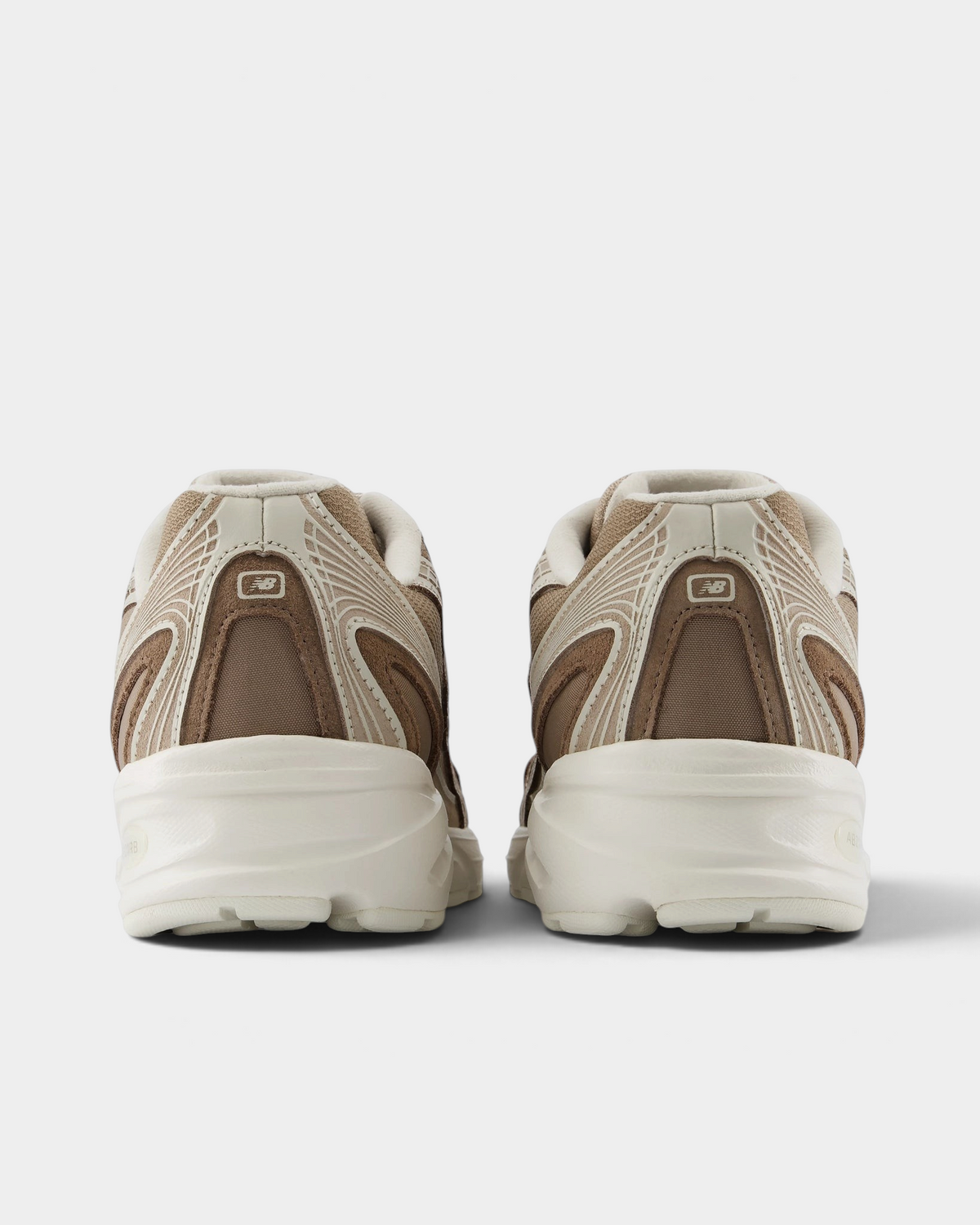 New Balance 740v2 Shoes in Mushroom/Driftwood, pair from behind: taupe heel panels with beige piping over a thick cream midsole