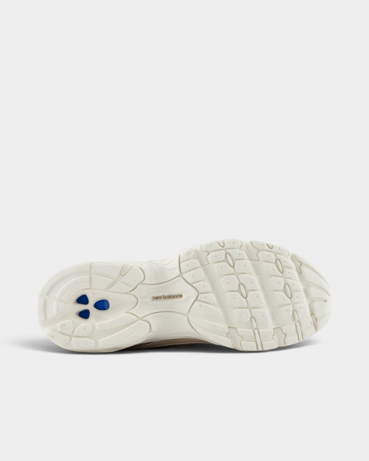 New Balance 740v2 Shoes in Mushroom/Driftwood, outsole: cream rubber with a ribbed tread pattern and blue pods at the heel
